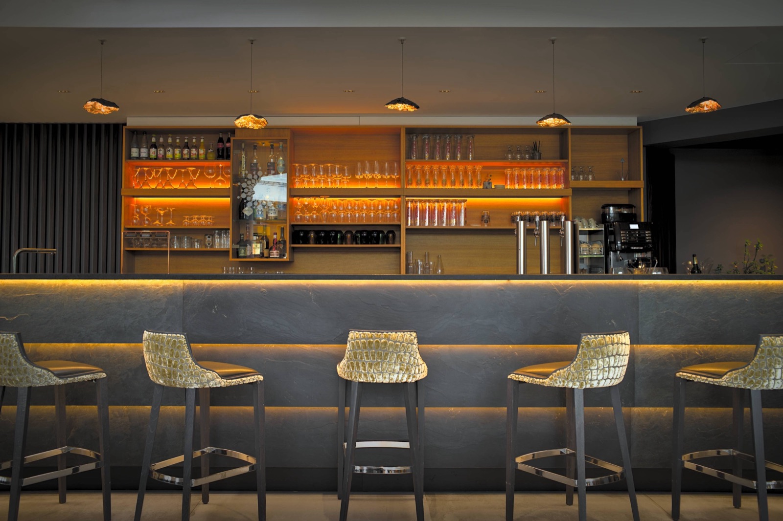 Four-star hotel bar lit up in the evening in Horbourg-Wihr, near Colmar